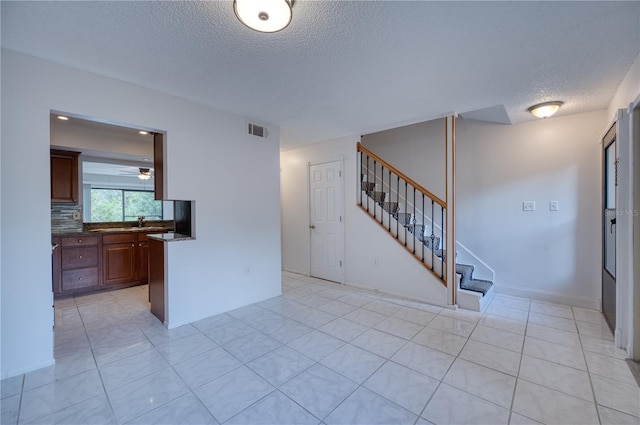 interior space with a textured ceiling