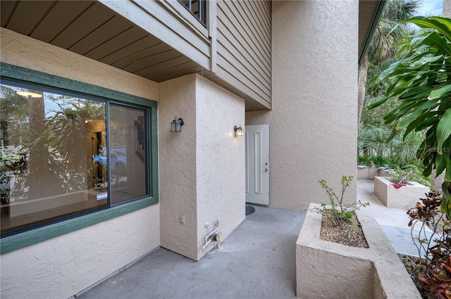 property entrance with a patio area