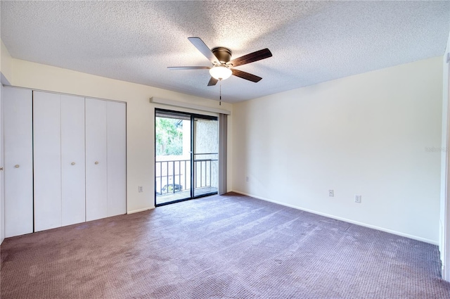 unfurnished bedroom with ceiling fan, a textured ceiling, access to outside, and dark colored carpet