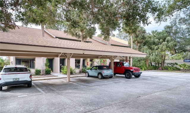 view of vehicle parking featuring a carport