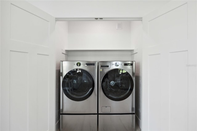 laundry area featuring washer and clothes dryer