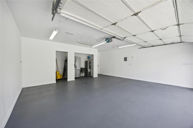 garage with a garage door opener and water heater