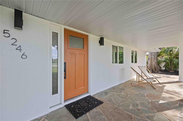 entrance to property with a patio