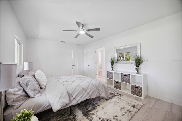 bedroom featuring light hardwood / wood-style floors and ceiling fan