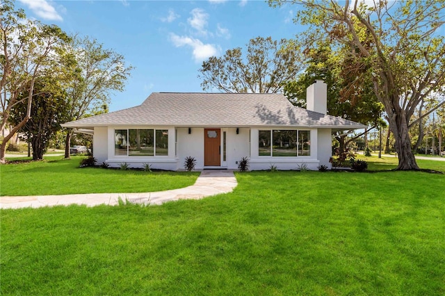 single story home with a front yard