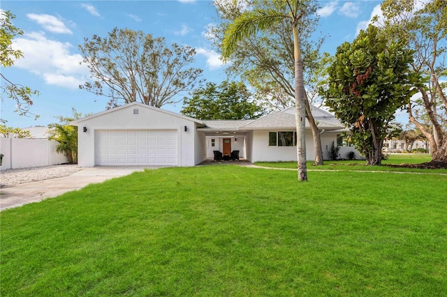 ranch-style house featuring a garage and a front lawn