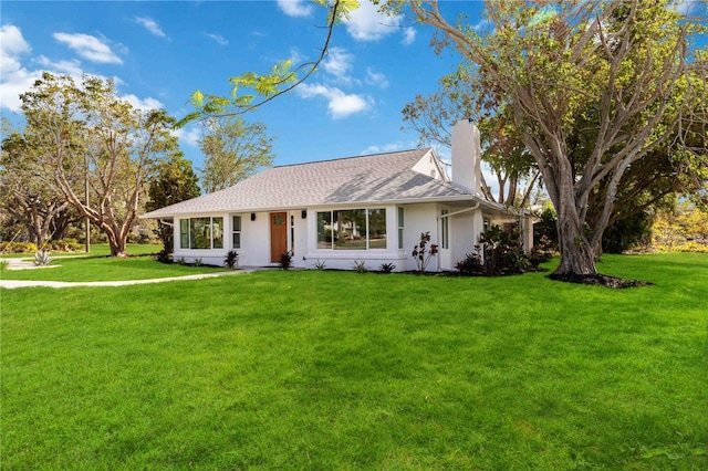 single story home featuring a front yard