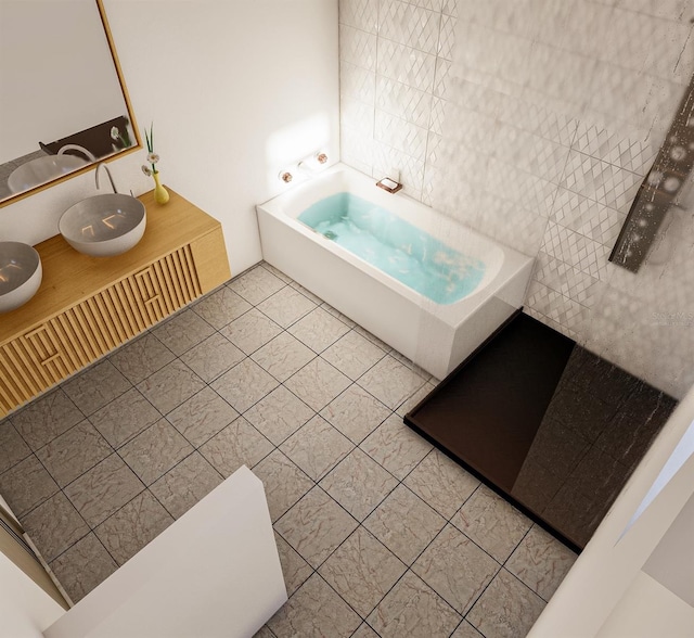 bathroom with tile patterned floors, a bathing tub, and tile walls