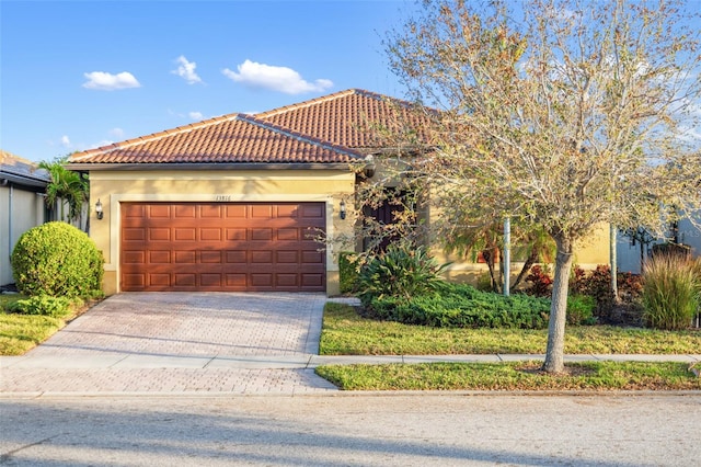 mediterranean / spanish-style house featuring a garage