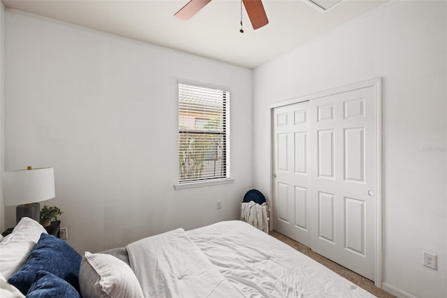 bedroom featuring carpet, ceiling fan, and a closet