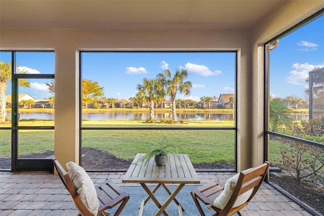 sunroom with a water view