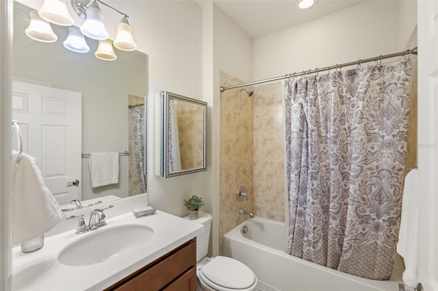 full bathroom with toilet, shower / tub combo with curtain, vanity, and a chandelier