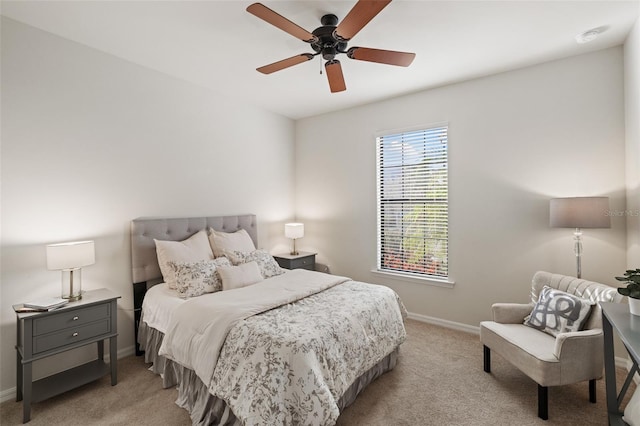 bedroom featuring light carpet and ceiling fan