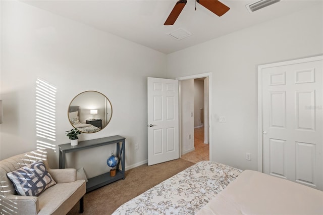 bedroom with light colored carpet and ceiling fan