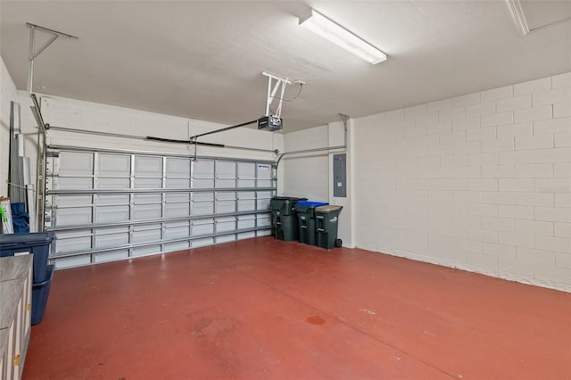 garage featuring a garage door opener and electric panel