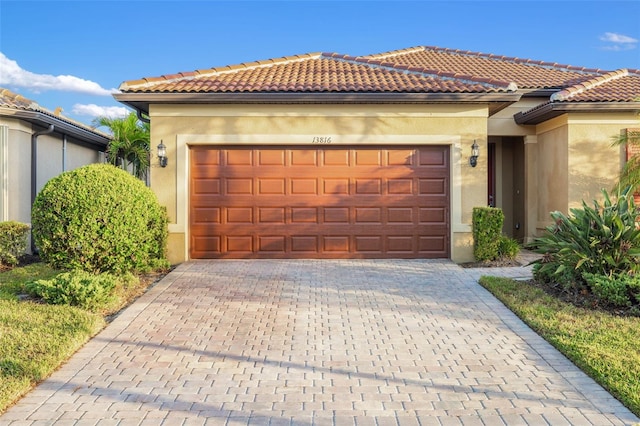 mediterranean / spanish-style house featuring a garage