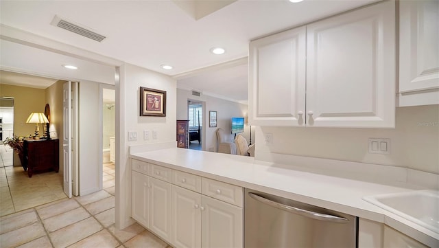 kitchen with white cabinetry, ornamental molding, dishwasher, and sink