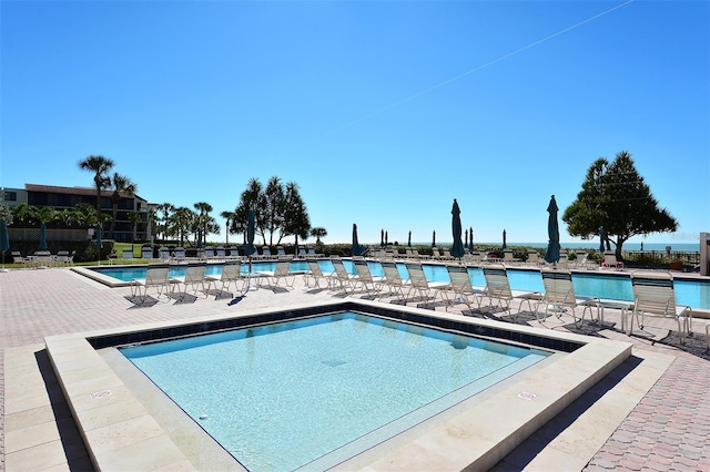 view of swimming pool with a patio area