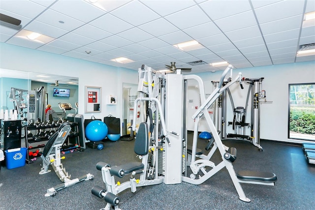 exercise room featuring a paneled ceiling