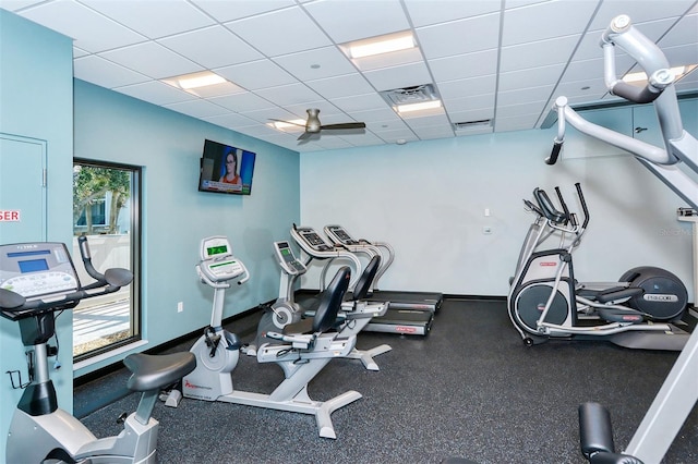 workout area featuring a drop ceiling and ceiling fan