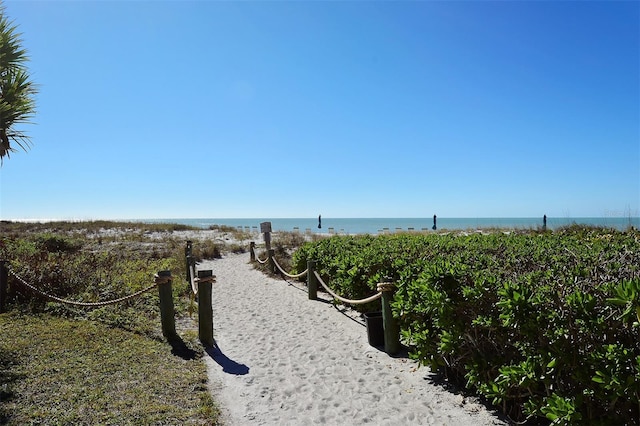 surrounding community featuring a water view