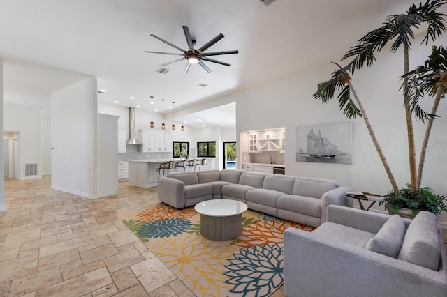 living room featuring lofted ceiling and ceiling fan