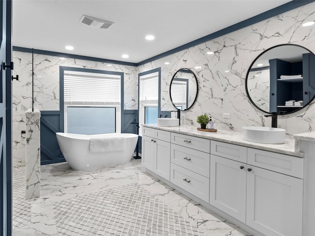 bathroom featuring ornamental molding, tile walls, vanity, and separate shower and tub