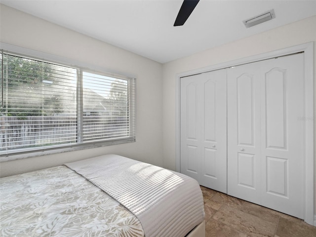 bedroom featuring a closet and ceiling fan