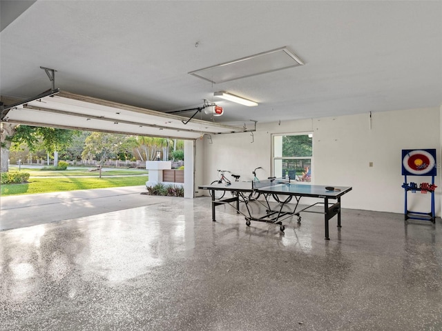 garage with a yard and a garage door opener