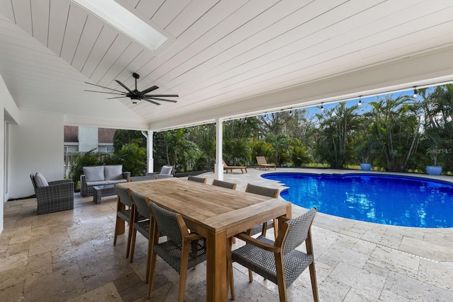 view of pool with a patio, outdoor lounge area, and ceiling fan