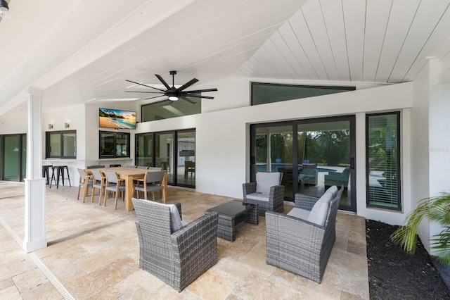 view of patio with ceiling fan and an outdoor living space