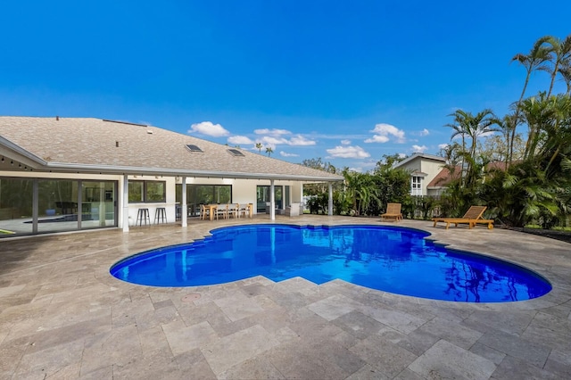 view of swimming pool featuring a patio