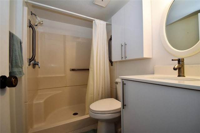 bathroom featuring toilet, a shower with curtain, and vanity