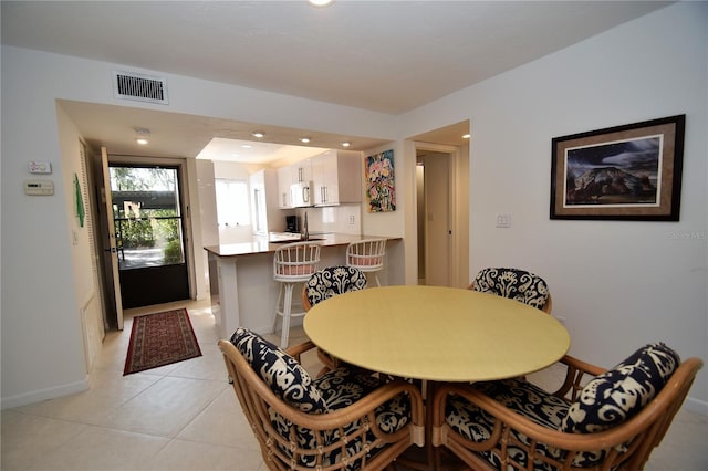 dining room featuring light tile patterned floors