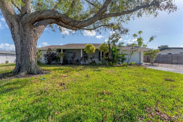 ranch-style house with a front yard and a garage