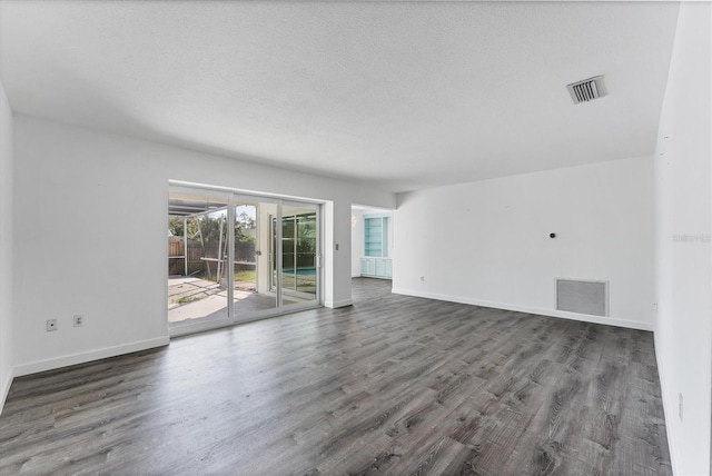 2420 Sunnyside St, Sarasota, FL 34239 - unfurnished living room with wood finished floors