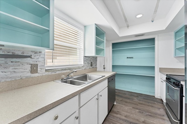 2420 Sunnyside St, Sarasota, FL 34239 - kitchen with open shelves, stainless steel appliances, white cabinetry, and dark wood-style floors