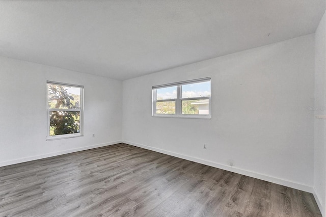 2420 Sunnyside St, Sarasota, FL 34239 - empty room featuring wood finished floors and baseboards