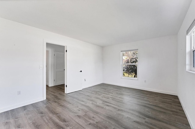 spare room with hardwood / wood-style floors