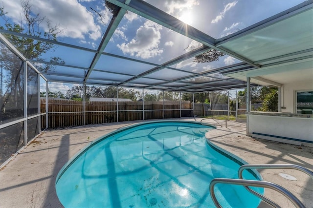 view of pool featuring a patio and a lanai