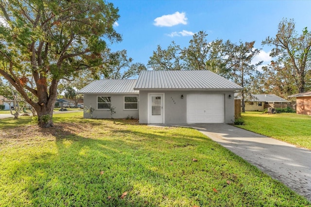 ranch-style home featuring a garage and a front lawn