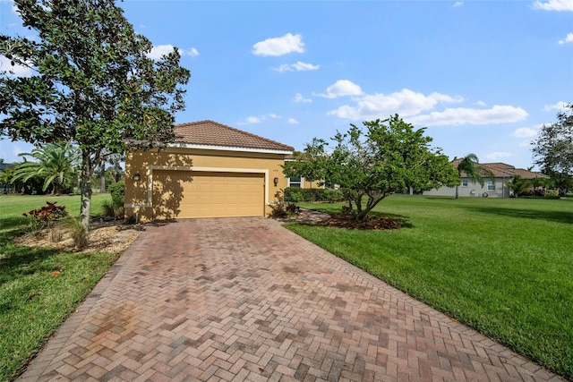 mediterranean / spanish-style home with a front lawn and a garage