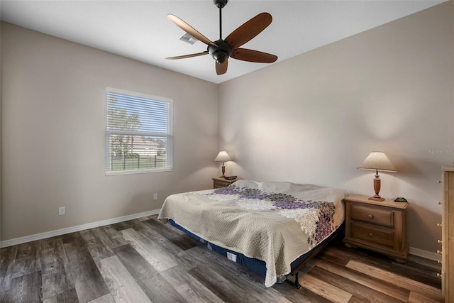 bedroom with dark wood-type flooring and ceiling fan