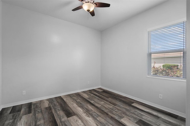 spare room with ceiling fan and dark hardwood / wood-style flooring