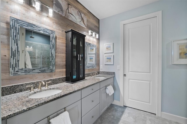 bathroom featuring vanity, tile patterned flooring, and walk in shower