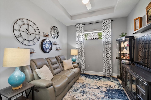 living room with a tray ceiling