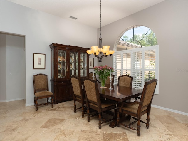 dining room featuring a chandelier