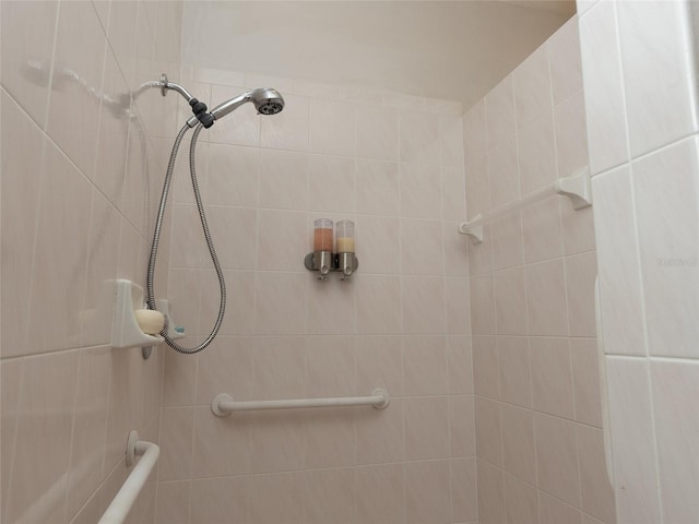 bathroom with a tile shower