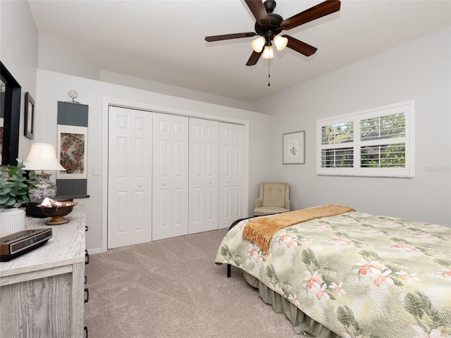 bedroom with carpet flooring, ceiling fan, and a closet