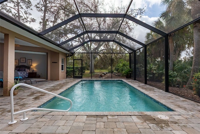 view of pool with a lanai and a patio area